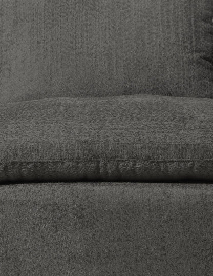 detalle de tela gris en sofá con textura suave y acabado acolchado