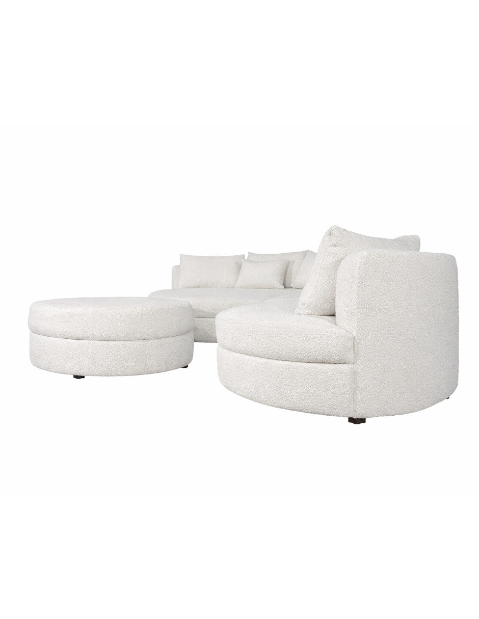 sofá modular curvo blanco vista lateral con chaise y taburete diseño orgánico toura
