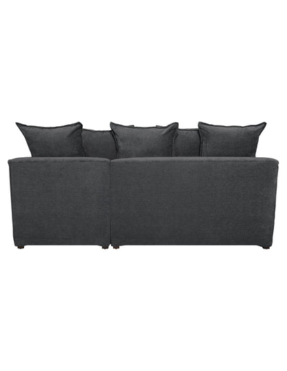 Vista trasera sofa en L moderno con chaise derecho, cojines amplios tipo almohadón 
